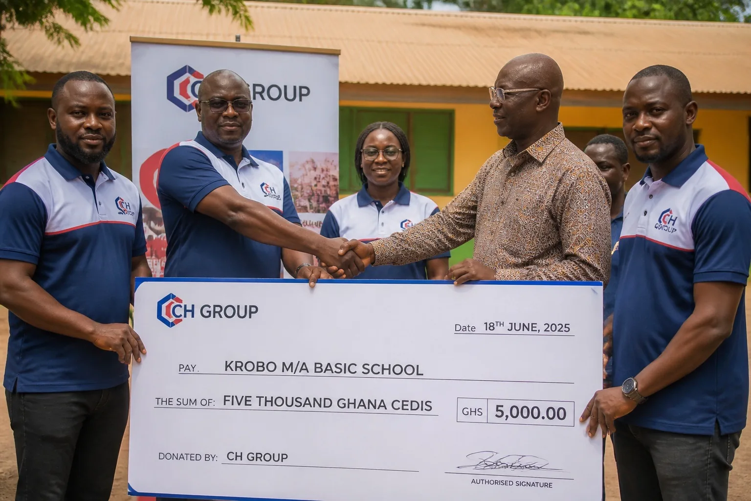A CH Group team presenting a donation to a Ghanaian basic school